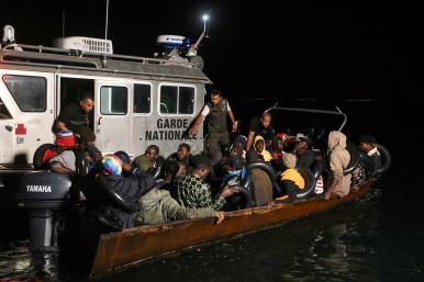 A Tunisian maritime patrol boat intercepts a migrant boat in the Mediterranean - source: Reuters